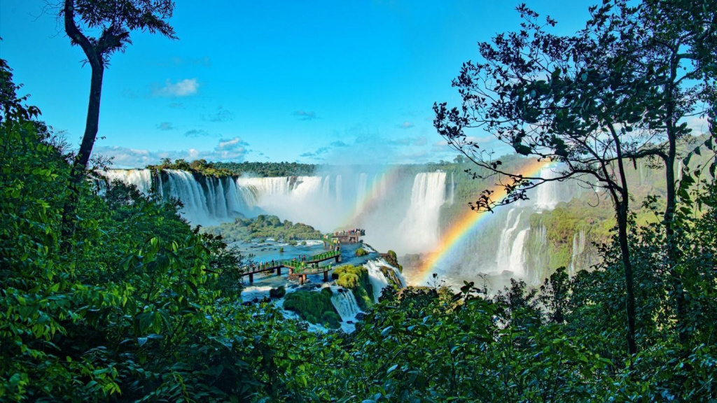 A rainbow over a waterfall AI-generated content may be incorrect.